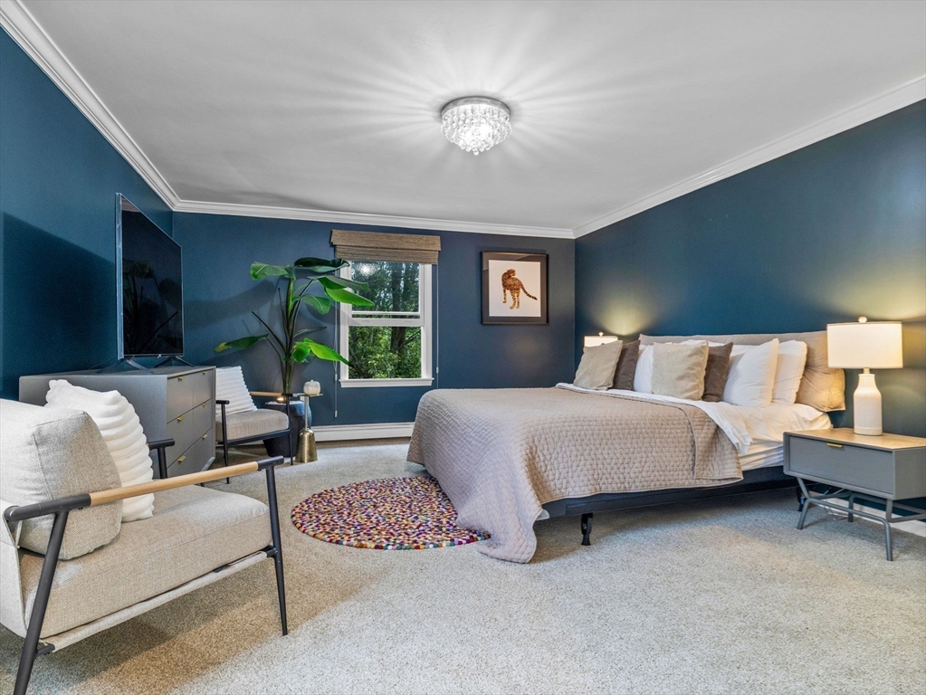 168 Maple Street Boston, MA 02132 - Photo 17 of 39 a bedroom with a bed lamp and window