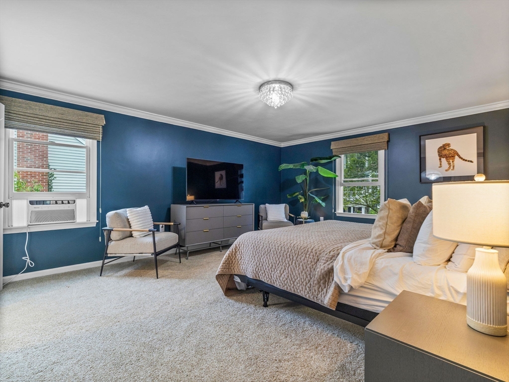 168 Maple Street Boston, MA 02132 - Photo 18 of 39 a bedroom with a bed and a couch