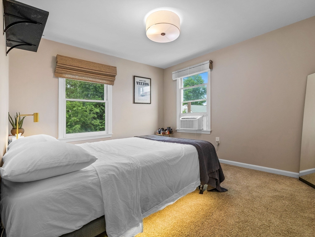 168 Maple Street Boston, MA 02132 - Photo 21 of 39 a bedroom with a bed and a window