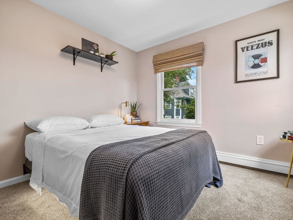 168 Maple Street Boston, MA 02132 - Photo 22 of 39 a bedroom with a bed and a window