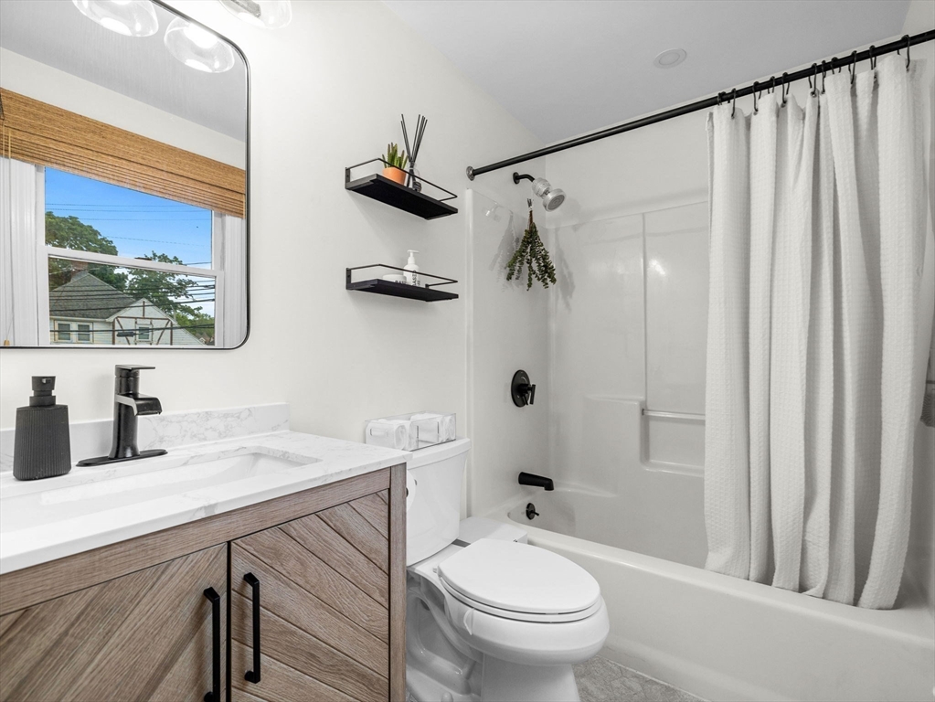 168 Maple Street Boston, MA 02132 - Photo 23 of 39 a bathroom with a sink a toilet and shower