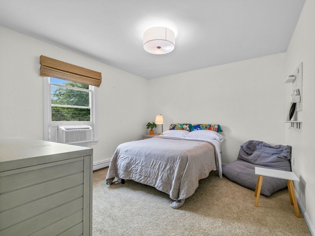 168 Maple Street Boston, MA 02132 - Photo 26 of 39 a bedroom with a bed and a window