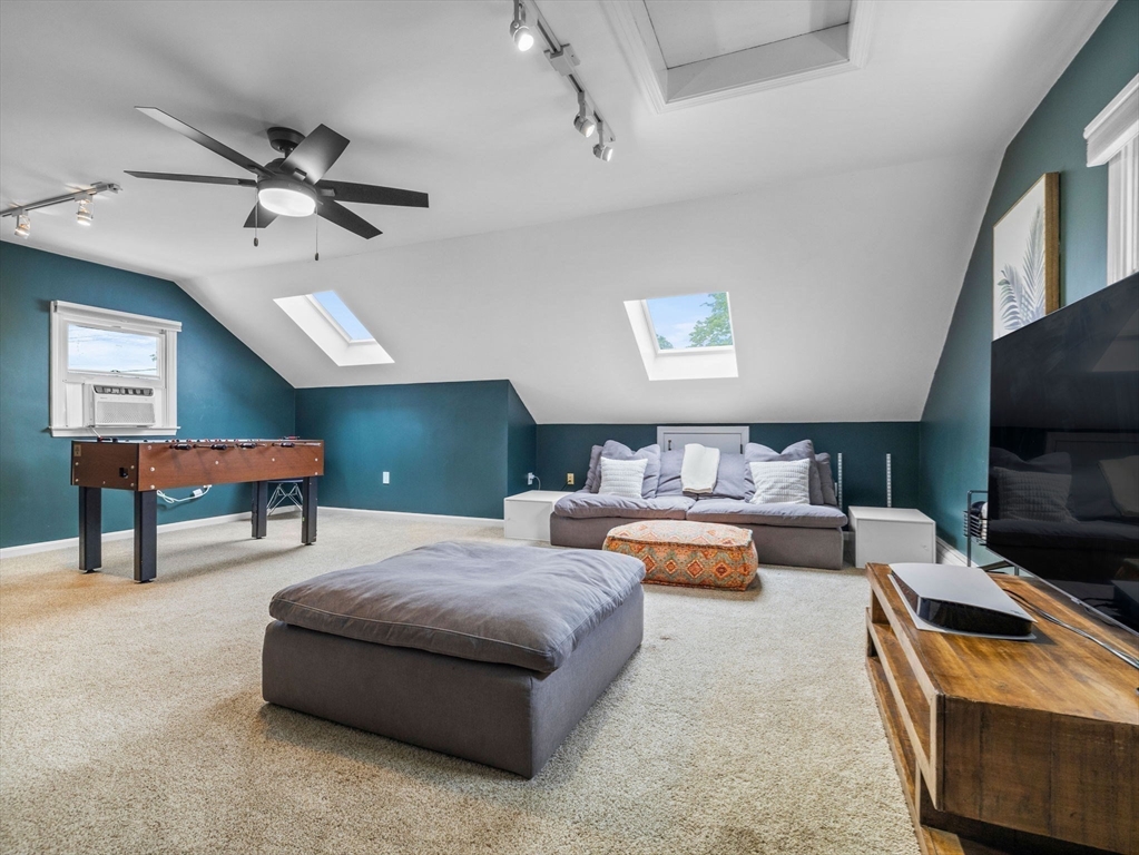 168 Maple Street Boston, MA 02132 - Photo 28 of 39 a living room with furniture and a flat screen tv