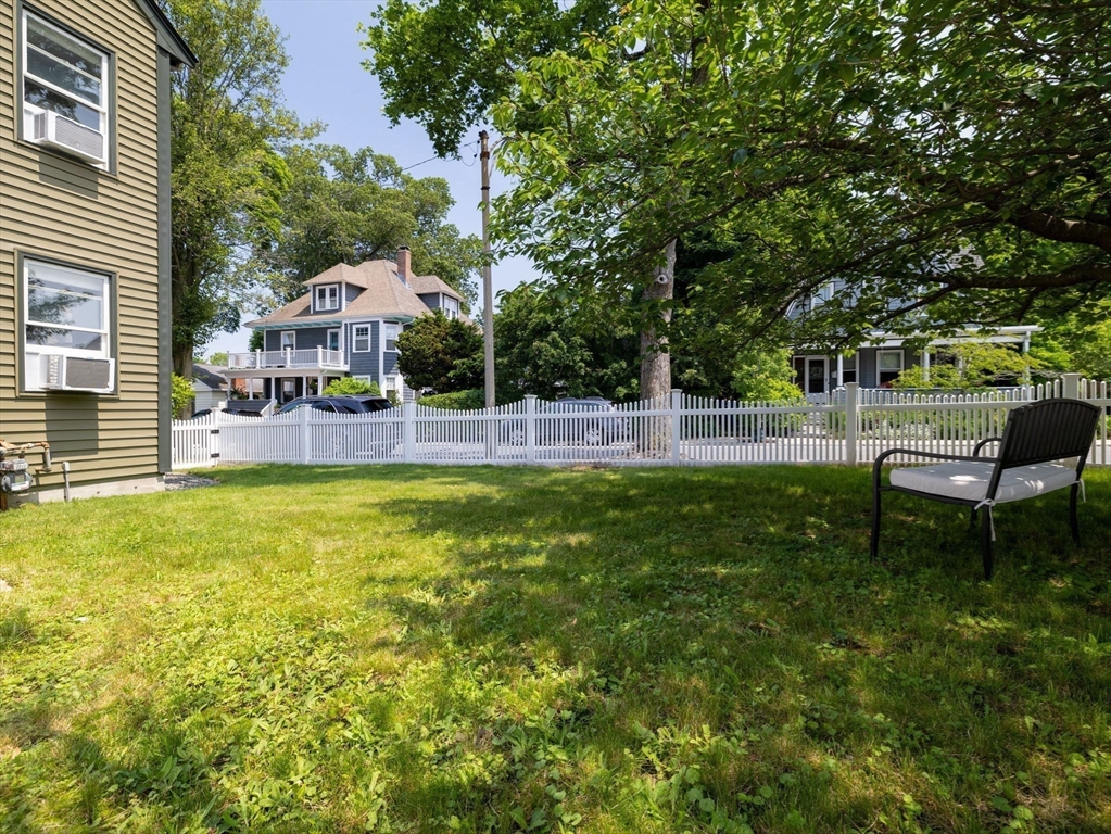 168 Maple Street Boston, MA 02132 - Photo 29 of 39 a backyard of a house with table and chairs