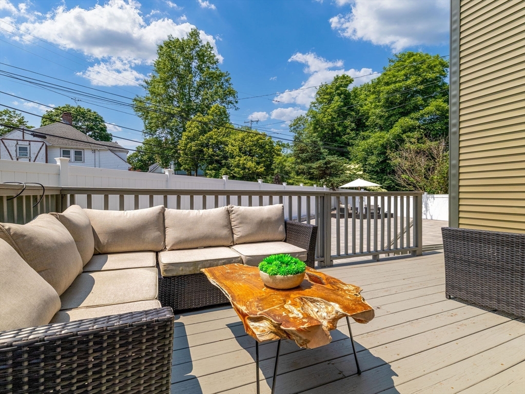 168 Maple Street Boston, MA 02132 - Photo 31 of 39 a view of a wooden deck with furniture