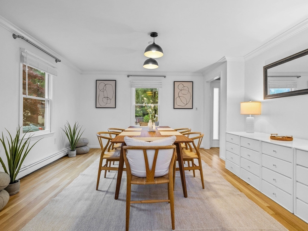 168 Maple Street Boston, MA 02132 - Photo 7 of 39 a view of a dining room with furniture window and wooden floor