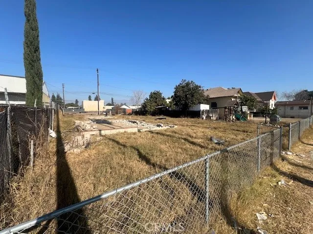 a view of a swimming pool with a lawn chairs