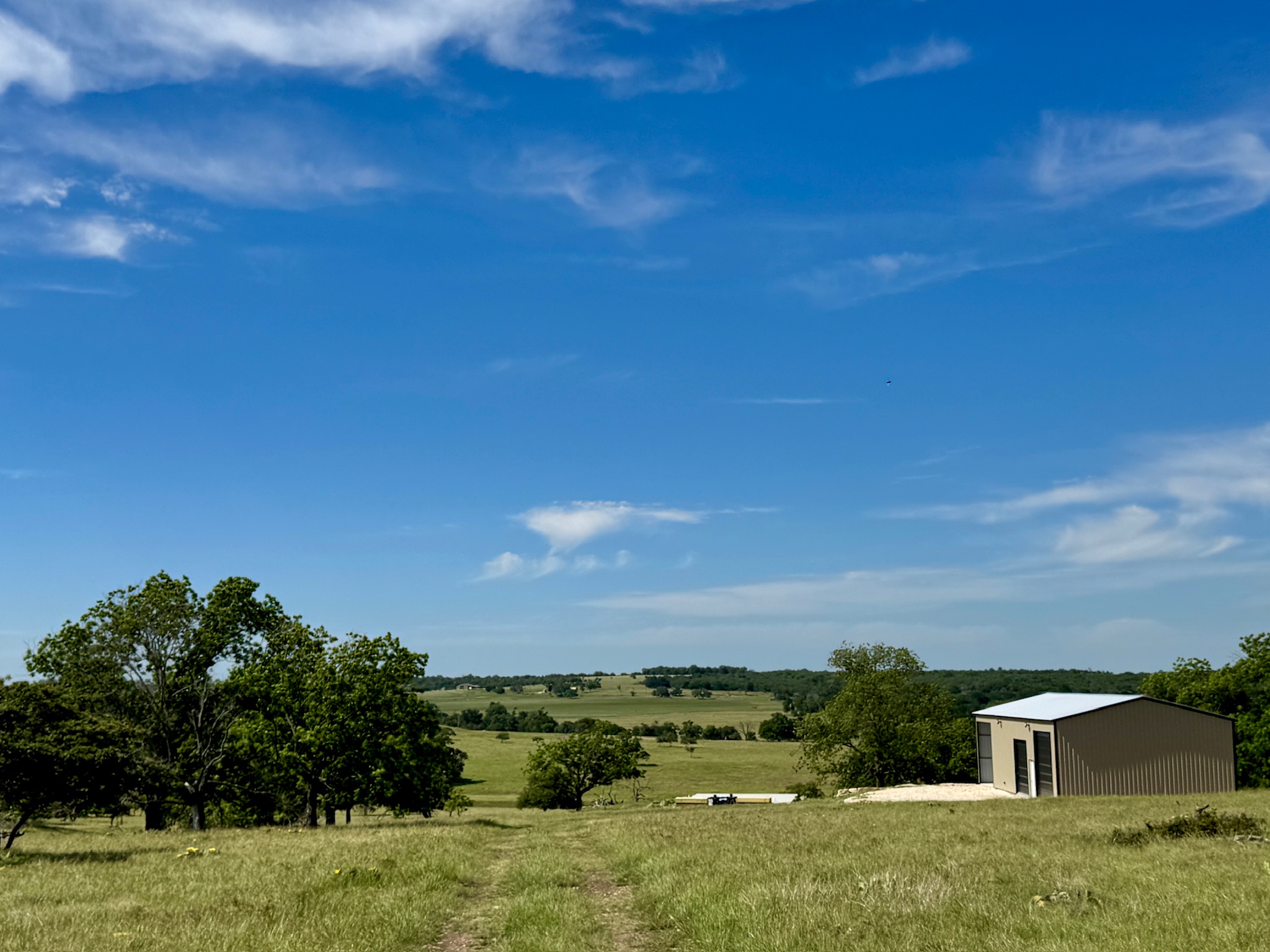 9 North Hcr 624 Road Hamilton, TX 76531 - Photo 11 of 40 a view of a field with a house in the background