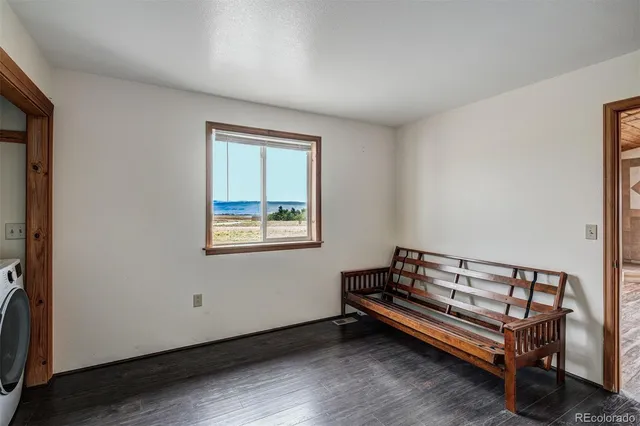 a view of wooden floor with a window