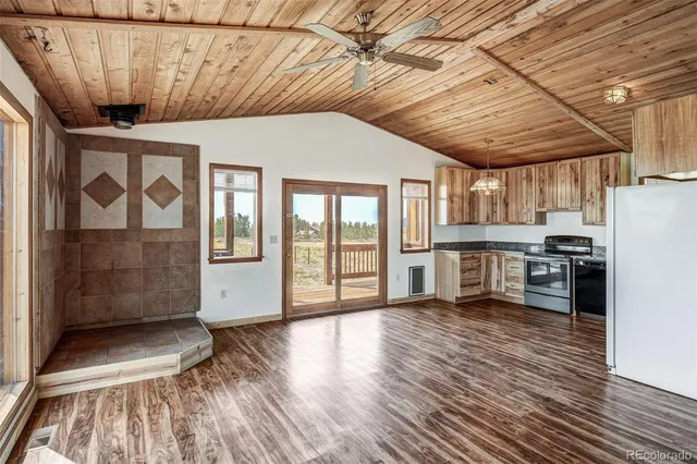 a view of a kitchen with a sink and cabinets