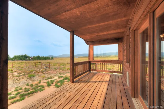 a view of balcony with wooden floor