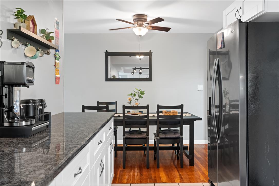 50 Kohls Road Northampton, PA 18067 - Photo 12 of 54 Granite counters and hardwood floors complement this cozy kitchen and dining space.