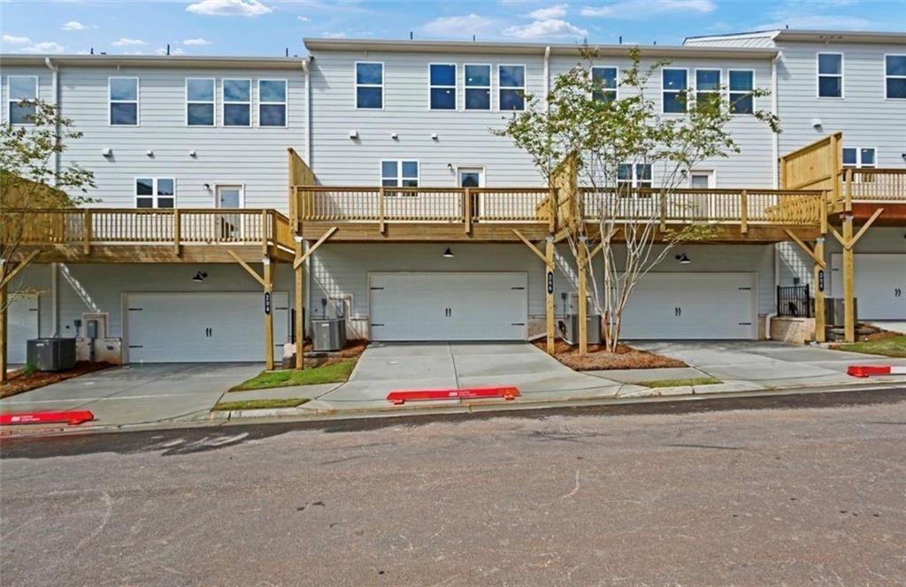 206 Maycrest Path Tucker, GA 30084 - Photo 16 of 18 a front view of a house with a road