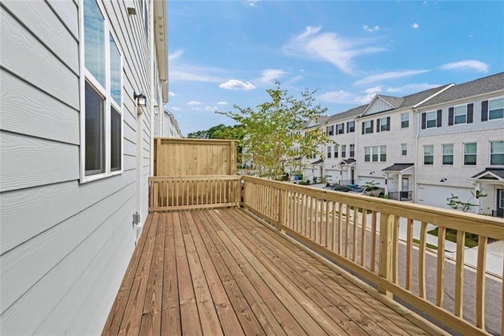 206 Maycrest Path Tucker, GA 30084 - Photo 6 of 18 a view of balcony with wooden floor and fence