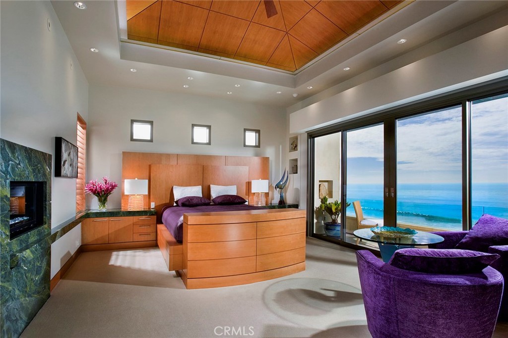 18 Ritz Cove Drive Dana Point, CA 92629 - Photo 11 of 25 a living room with furniture a flat screen tv and floor to ceiling window