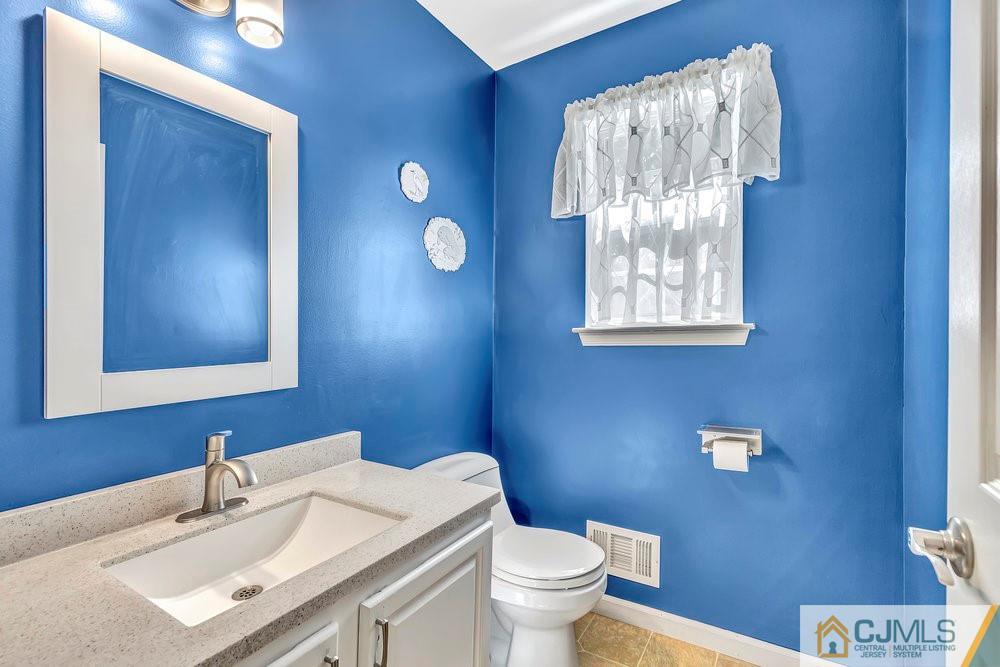 5 Netty Street Howell, NJ 07731 - Photo 20 of 36 a bathroom with a sink vanity mirror and toilet