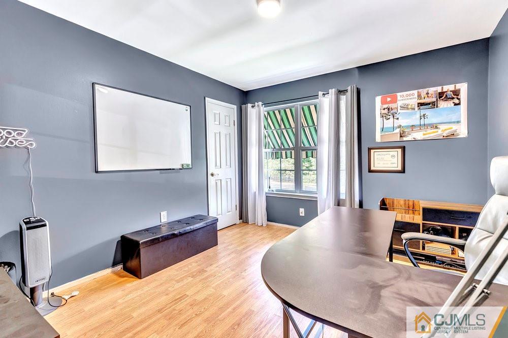 5 Netty Street Howell, NJ 07731 - Photo 23 of 36 a bedroom with a bed and wooden floor