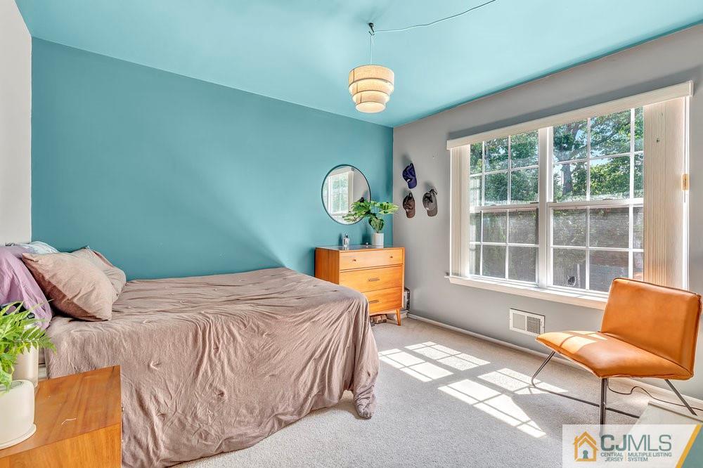 5 Netty Street Howell, NJ 07731 - Photo 24 of 36 a bedroom with a bed and a chair