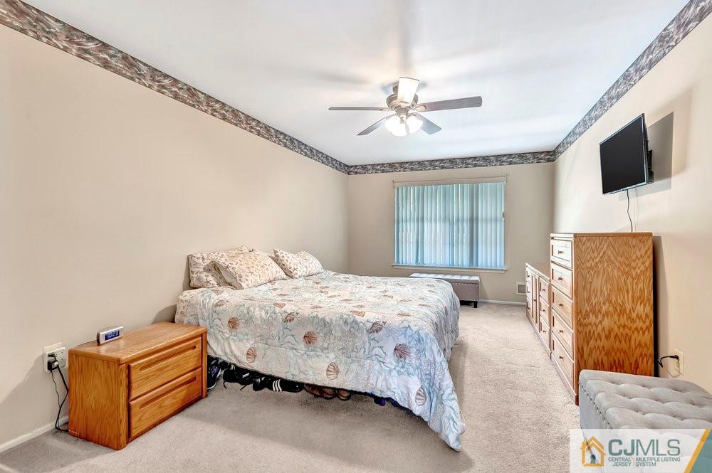 5 Netty Street Howell, NJ 07731 - Photo 26 of 36 a bedroom with a bed couch and window