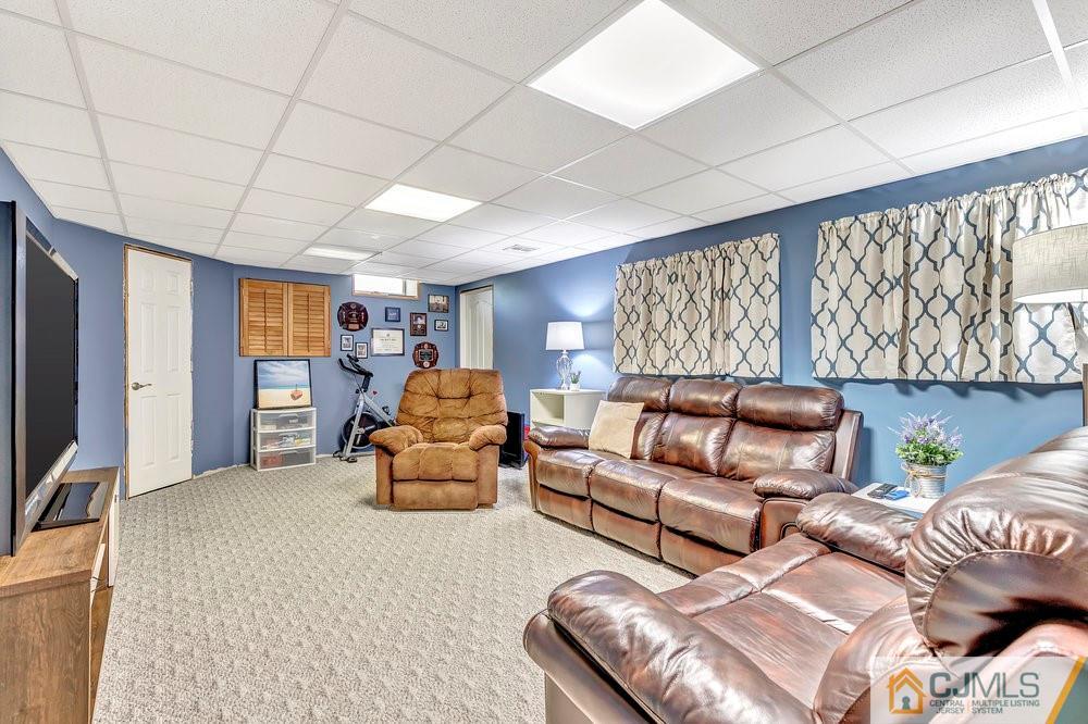 5 Netty Street Howell, NJ 07731 - Photo 29 of 36 a living room with furniture ceiling fan and a window