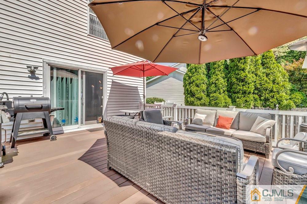 5 Netty Street Howell, NJ 07731 - Photo 32 of 36 a balcony with furniture and umbrella