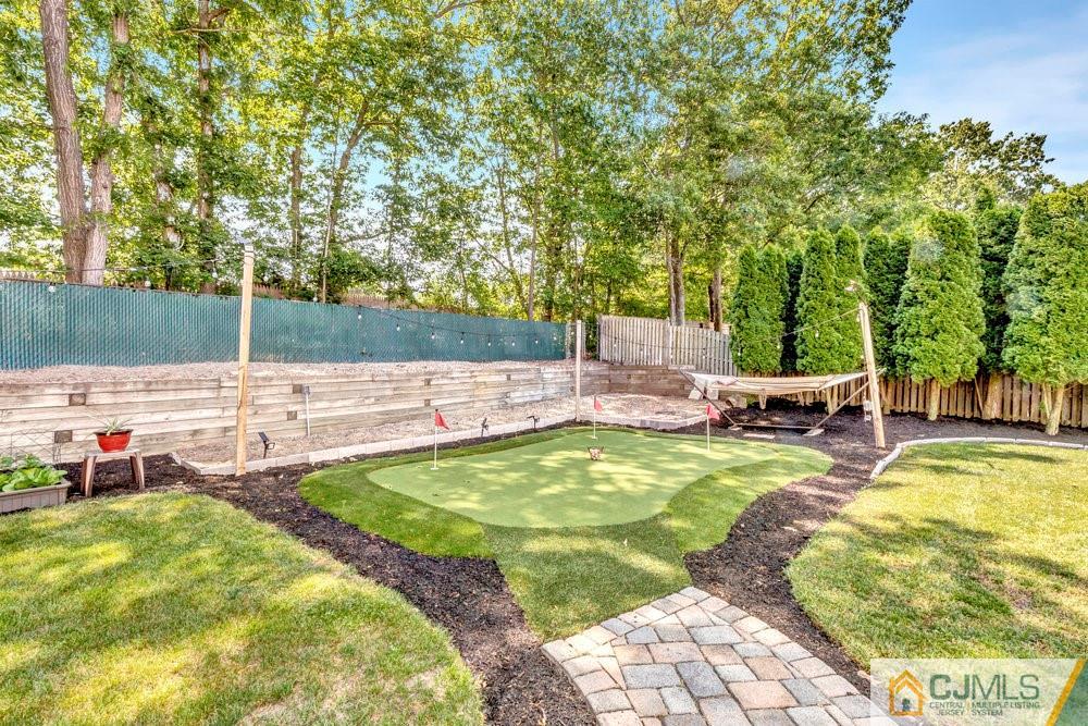 5 Netty Street Howell, NJ 07731 - Photo 34 of 36 a view of swimming pool with lawn chairs under an umbrella