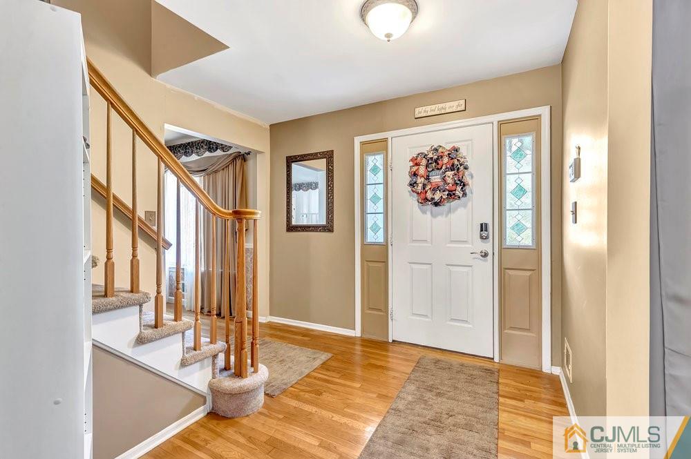 5 Netty Street Howell, NJ 07731 - Photo 5 of 36 a view of an entryway with wooden floor