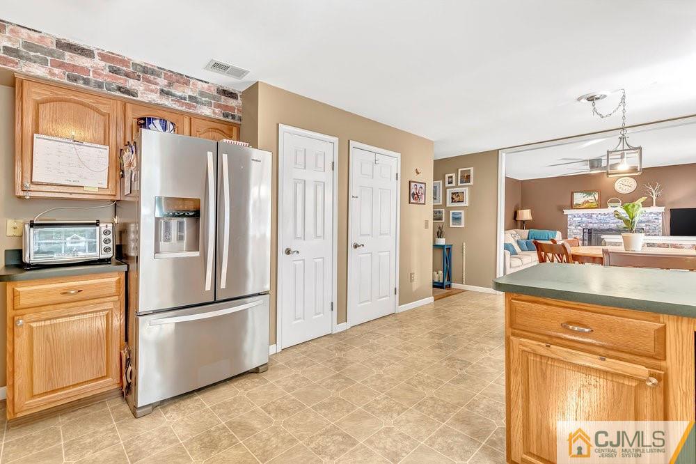 5 Netty Street Howell, NJ 07731 - Photo 10 of 36 a kitchen with stainless steel appliances granite countertop a refrigerator and a stove top oven