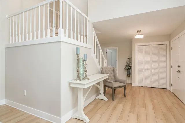 a living room with a sink and a wooden floor