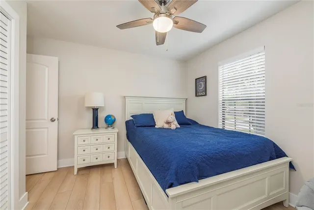 a bed room with a bed and a chandelier