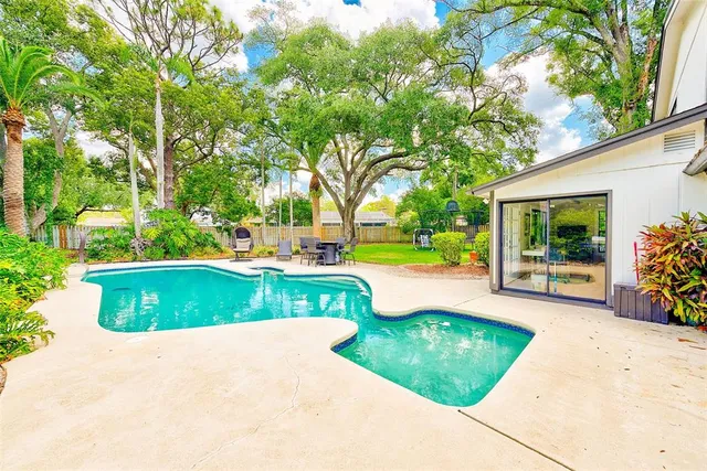 a view of a swimming pool with a patio