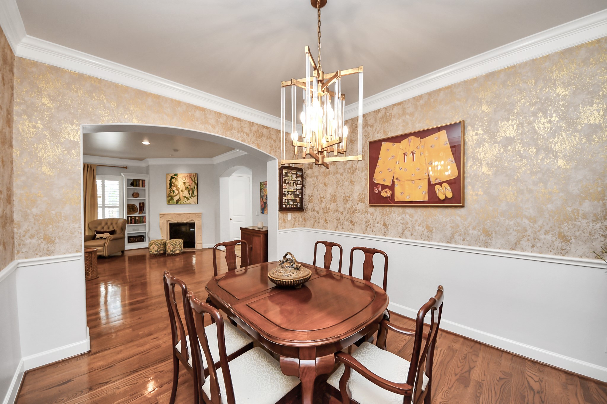6302 Hermann Lake Drive Houston, TX 77021 - Photo 15 of 50 Beautiful wallpaper, installed as part of the home’s interior upgrades, adds warmth and sophistication to the space, while the stunning chandelier creates a refined ambiance for evening gatherings.