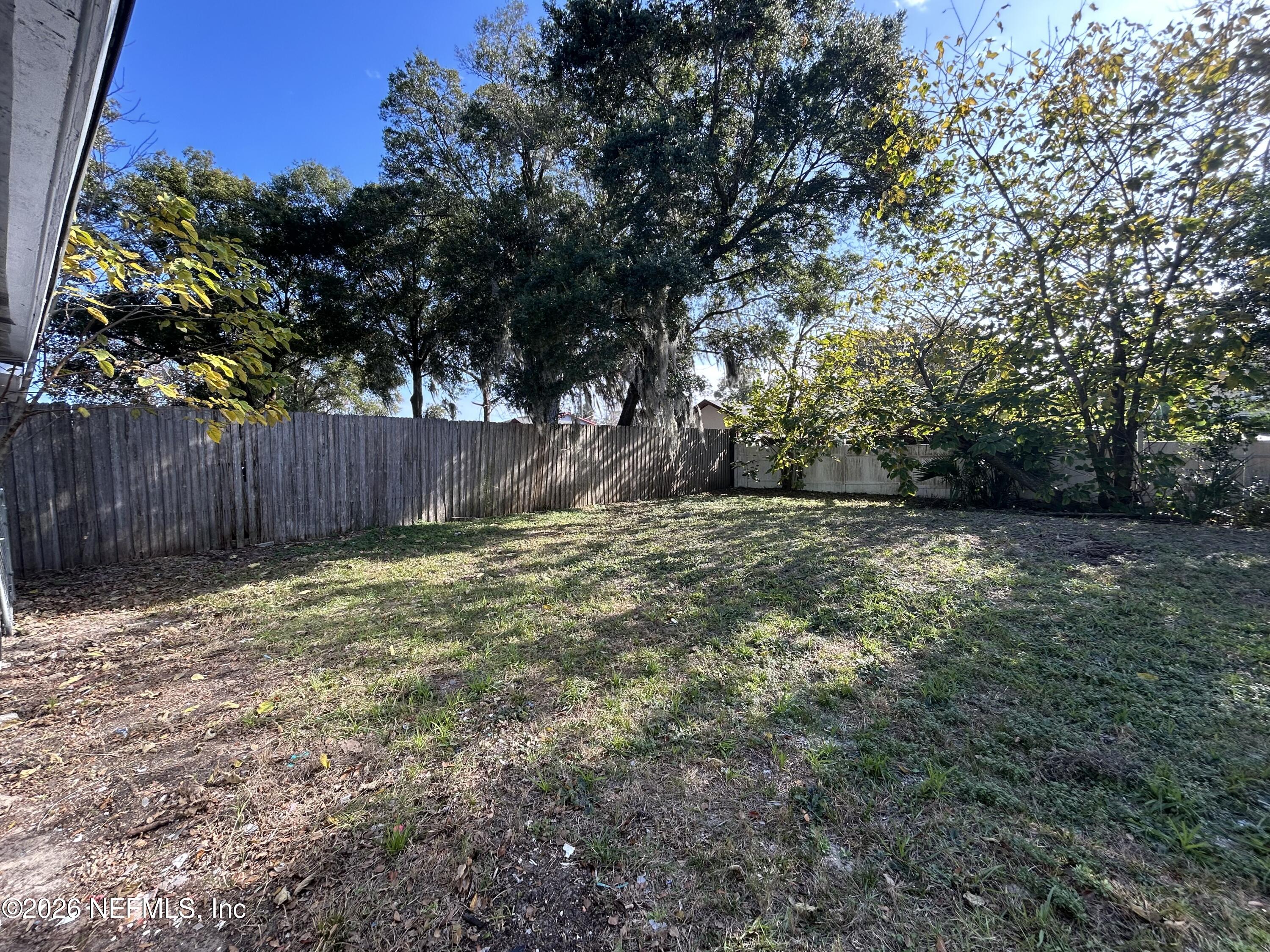10610 Lone Star Road Jacksonville, FL 32225 - Photo 18 of 18 a view of backyard with tree