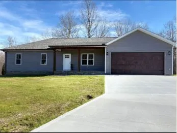 a house view with a garden space