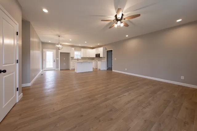a view of a kitchen with a sink and microwave