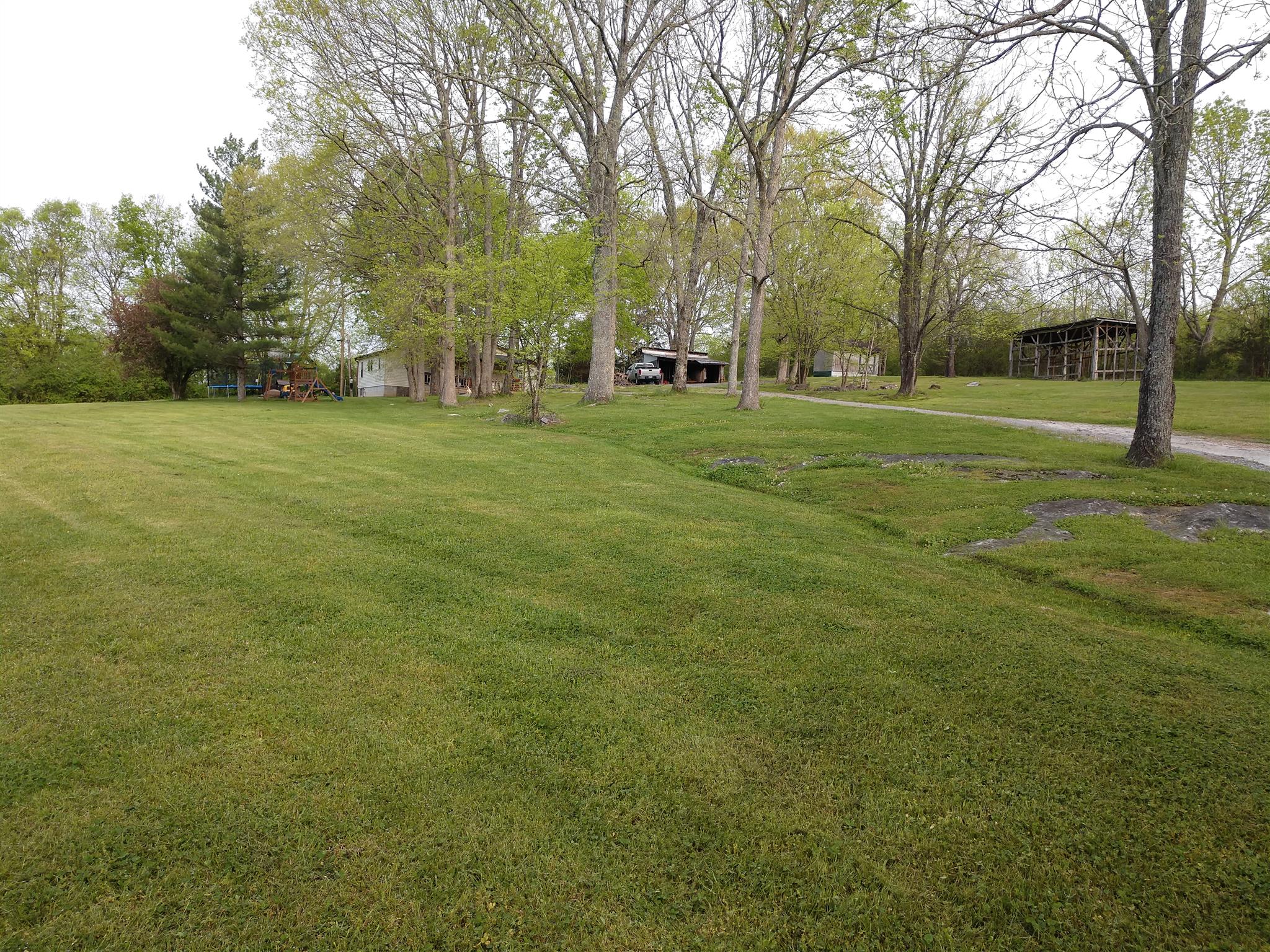 3627 New Hope Road Alexandria, TN 37012 - Photo 22 of 24 a view of building with trees