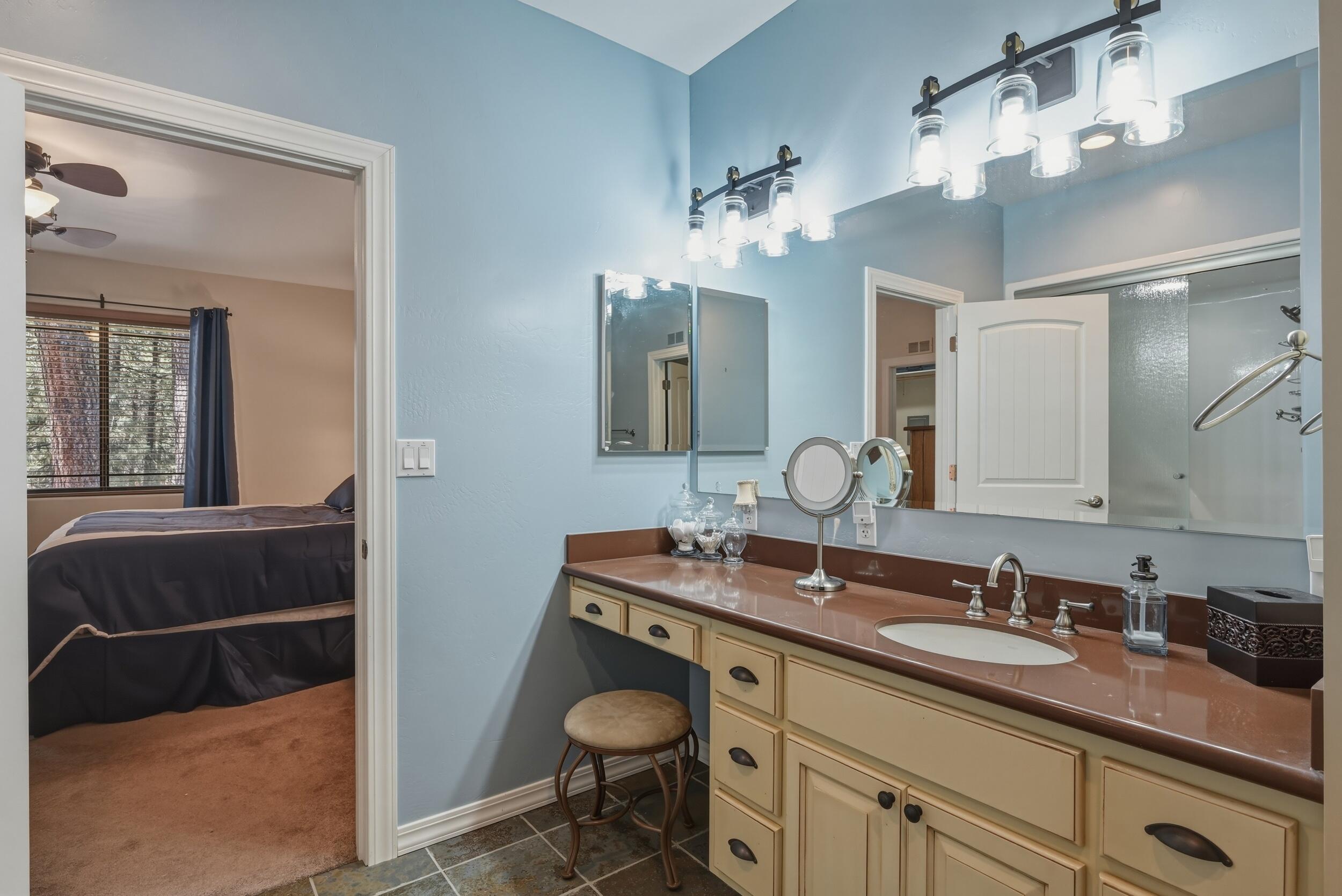 1233 Merzville Road Forest Lakes, AZ 85931 - Photo 18 of 39 a bathroom with a sink double vanity and a mirror
