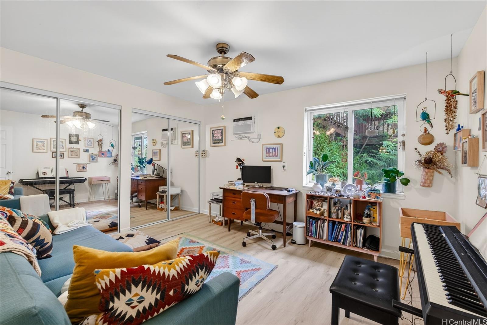 5207 Poola Street Honolulu, HI 96821 - Photo 13 of 25 a living room with furniture fireplace and a large window