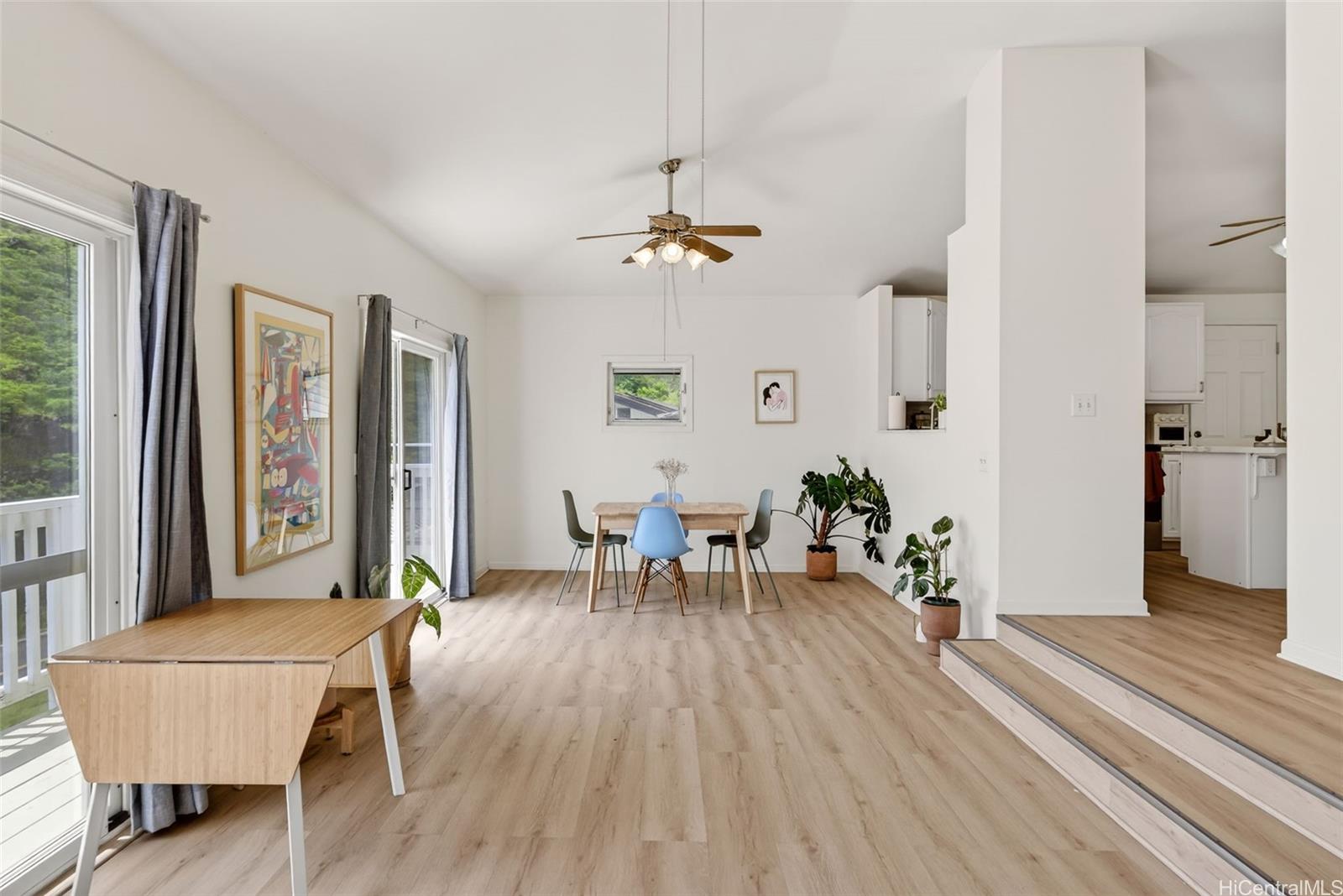 5207 Poola Street Honolulu, HI 96821 - Photo 3 of 25 a living room with furniture two window and a ceiling fan