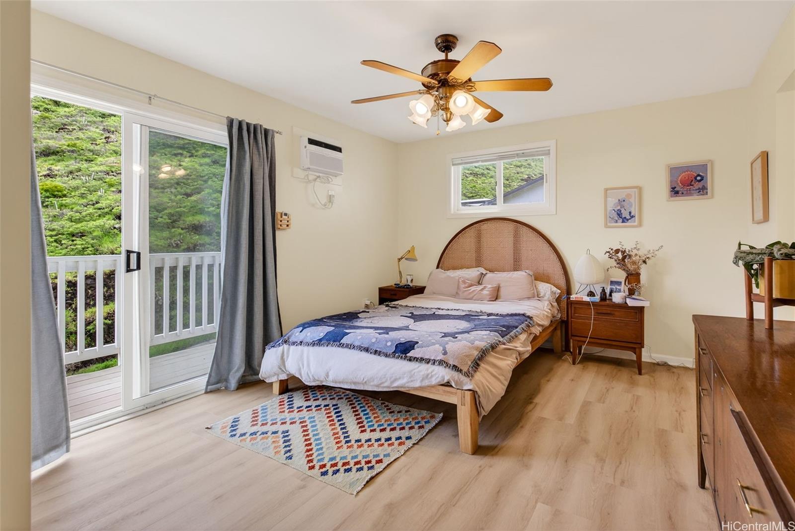 5207 Poola Street Honolulu, HI 96821 - Photo 8 of 25 a bedroom with a bed and a large window