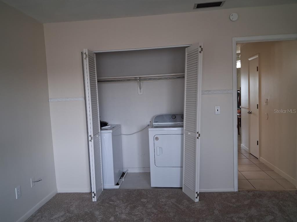 4744 Azalea Drive, Unit 204 New Port Richey, FL 34652 - Photo 12 of 20 a room with closet and dryer