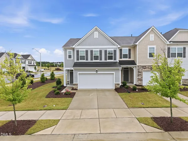 a front view of a house with yard