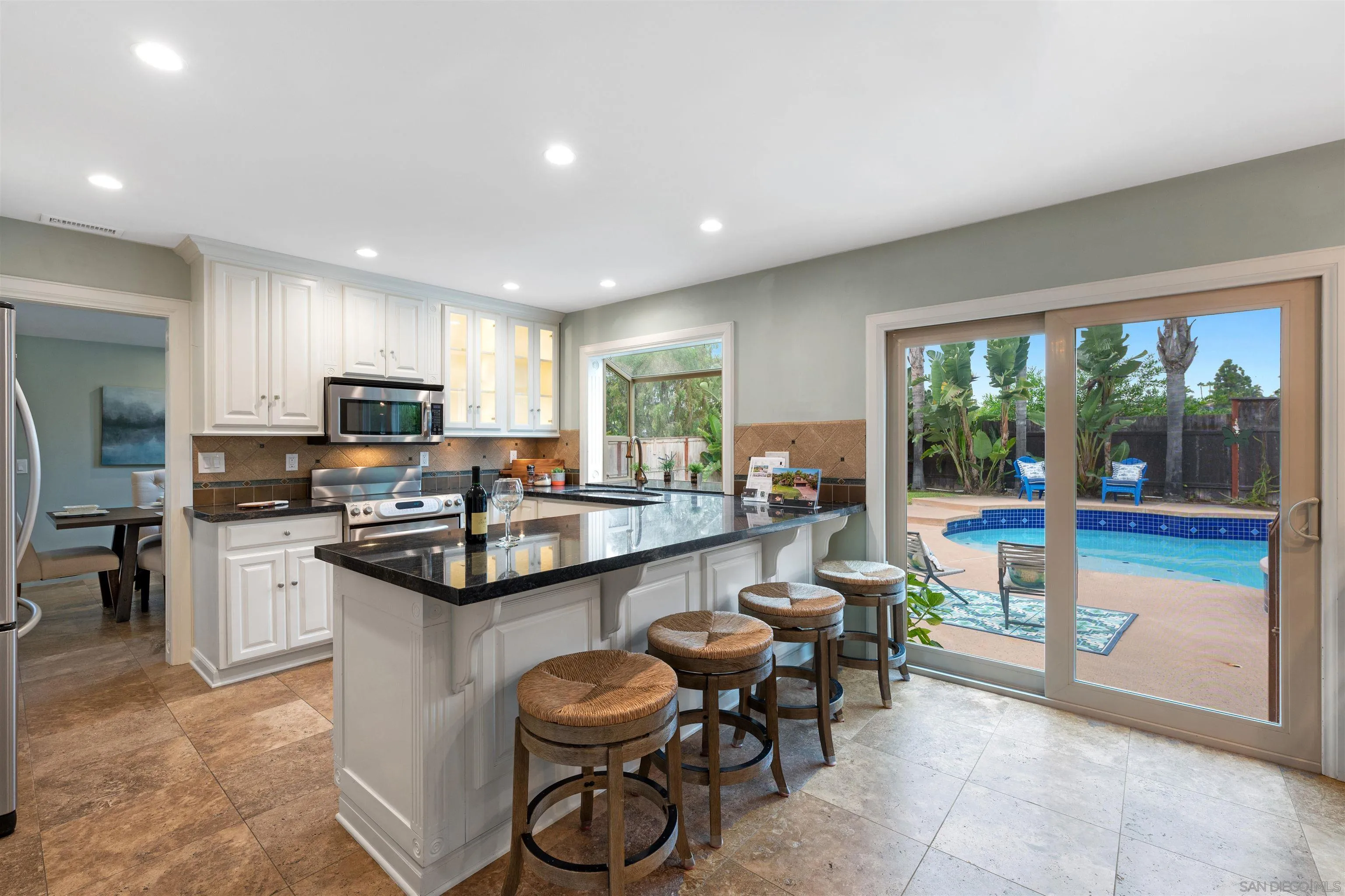 2312 Marca Place Carlsbad, CA 92009 - Photo 11 of 56 a kitchen with sink cabinets and outdoor view