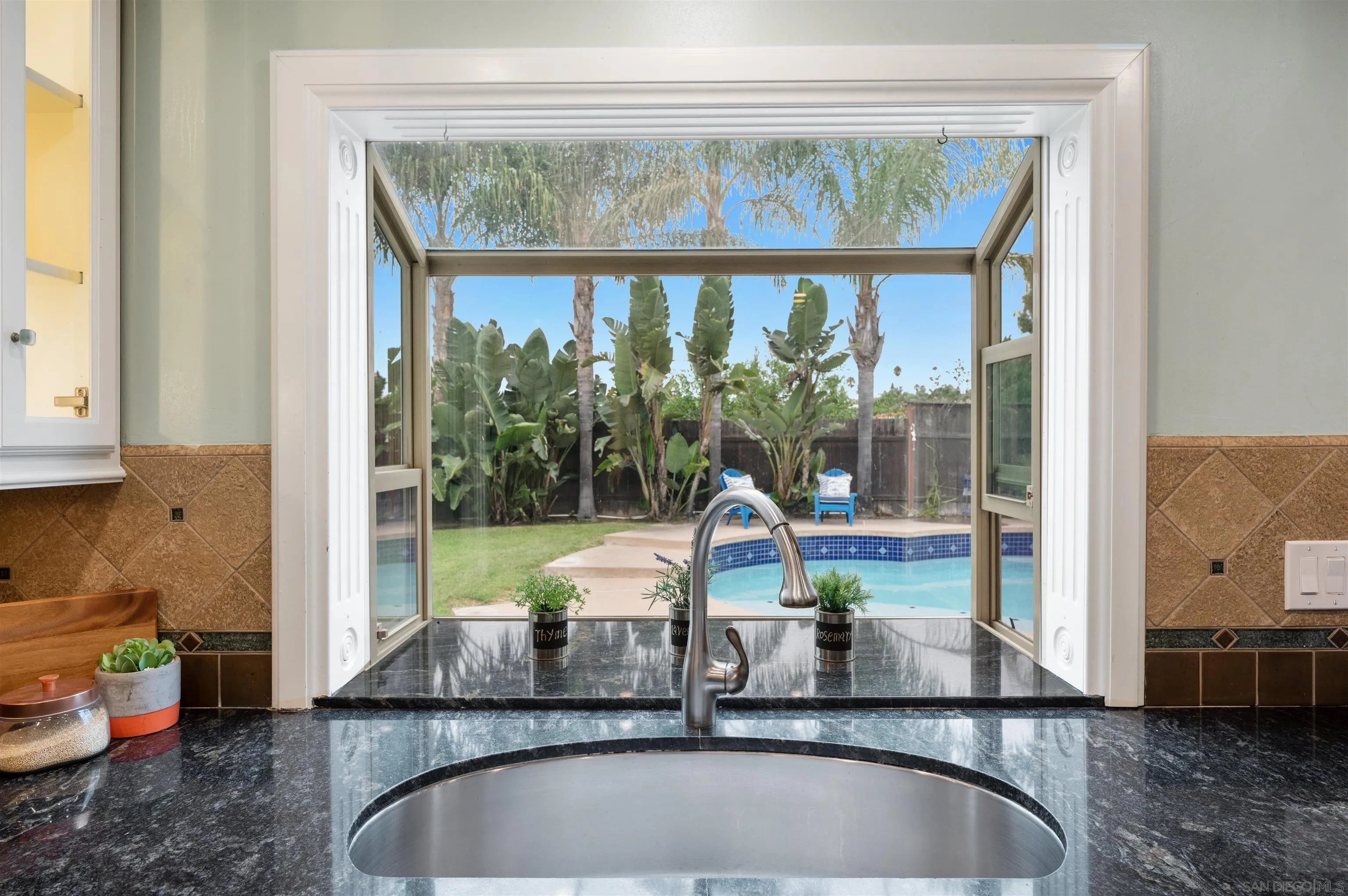 2312 Marca Place Carlsbad, CA 92009 - Photo 13 of 56 a view of a kitchen with a sink and large window