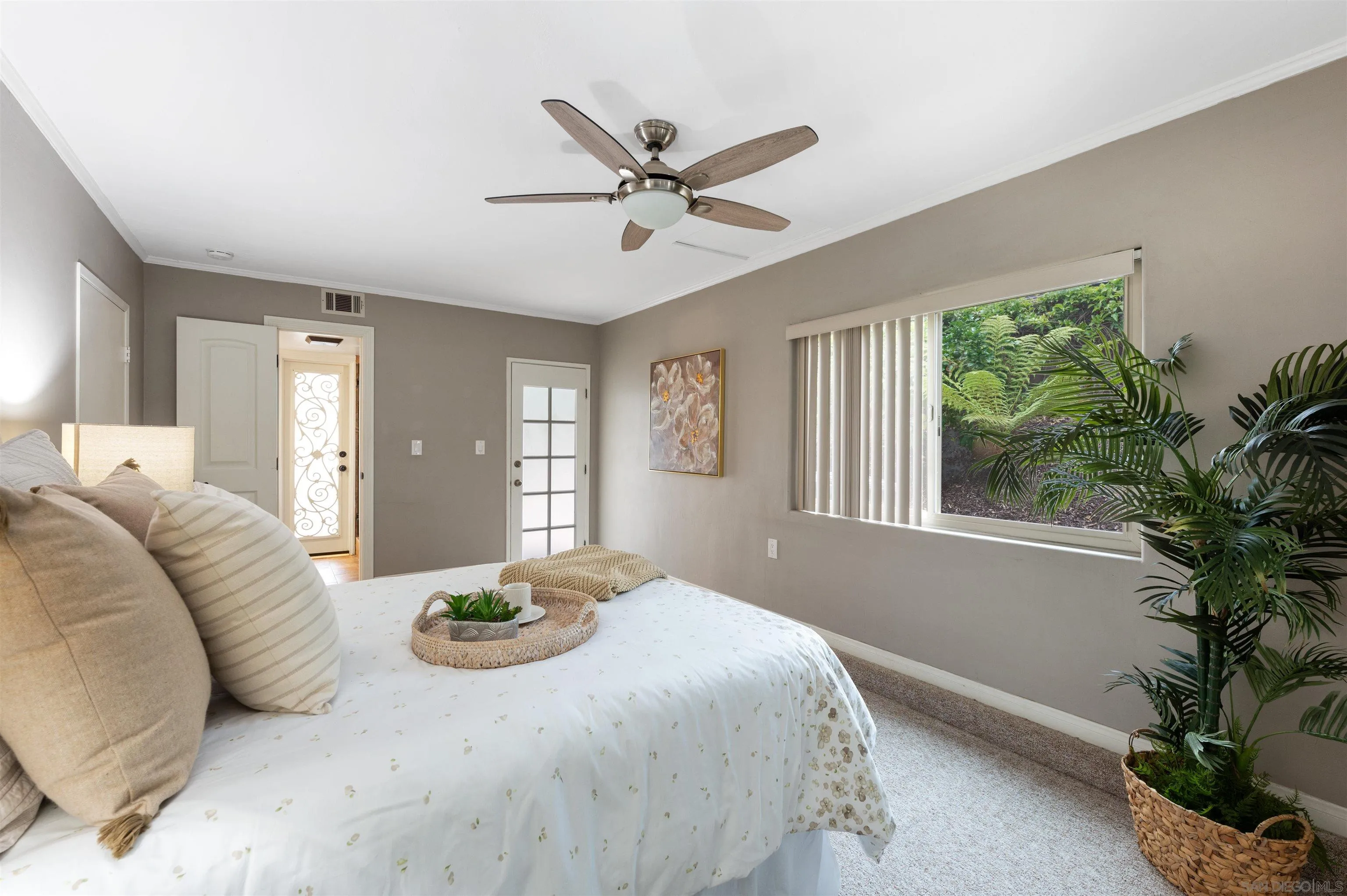 2312 Marca Place Carlsbad, CA 92009 - Photo 23 of 56 a bedroom with a bed and window