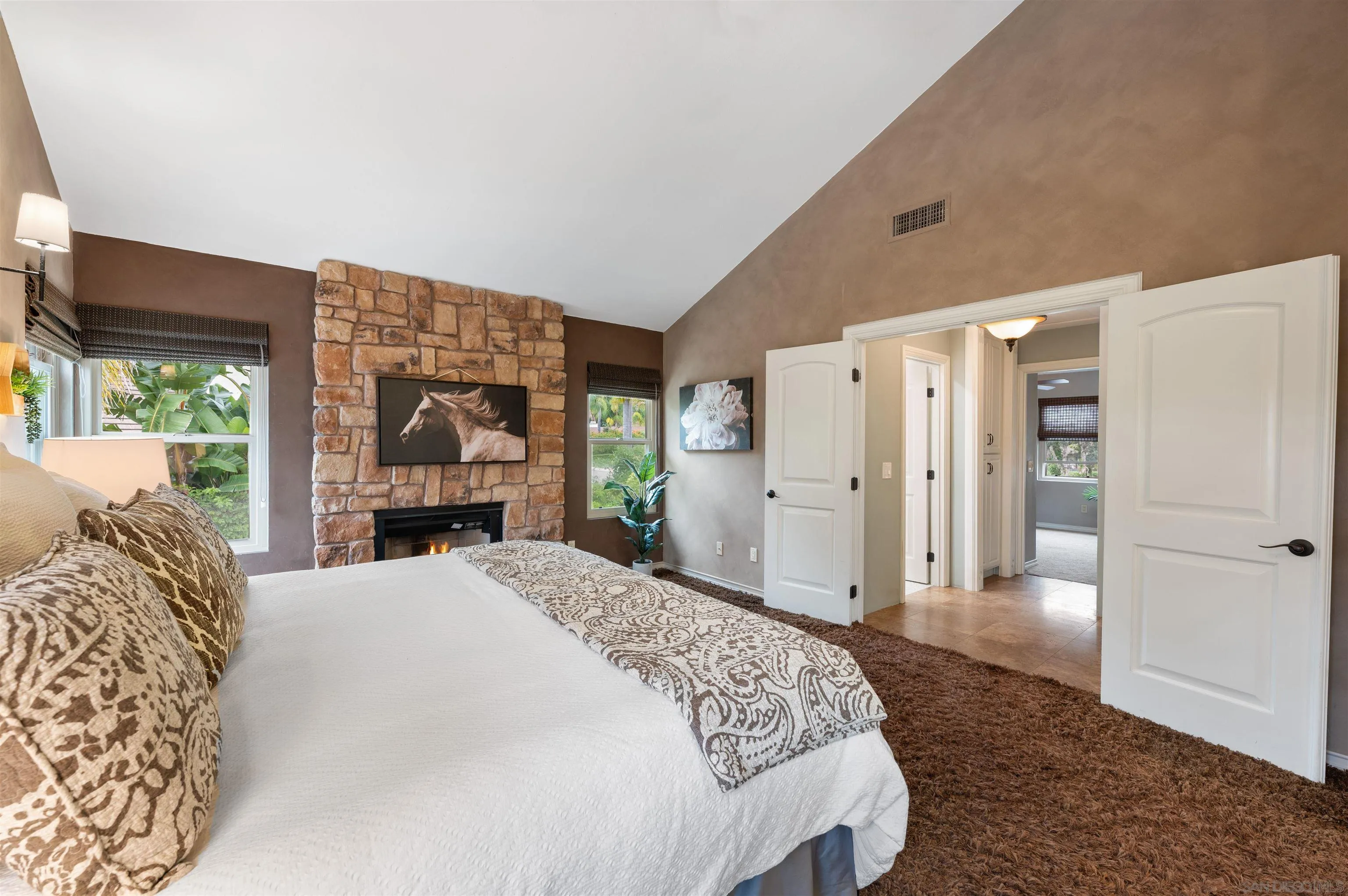 2312 Marca Place Carlsbad, CA 92009 - Photo 30 of 56 a spacious bedroom with a bed and a dresser