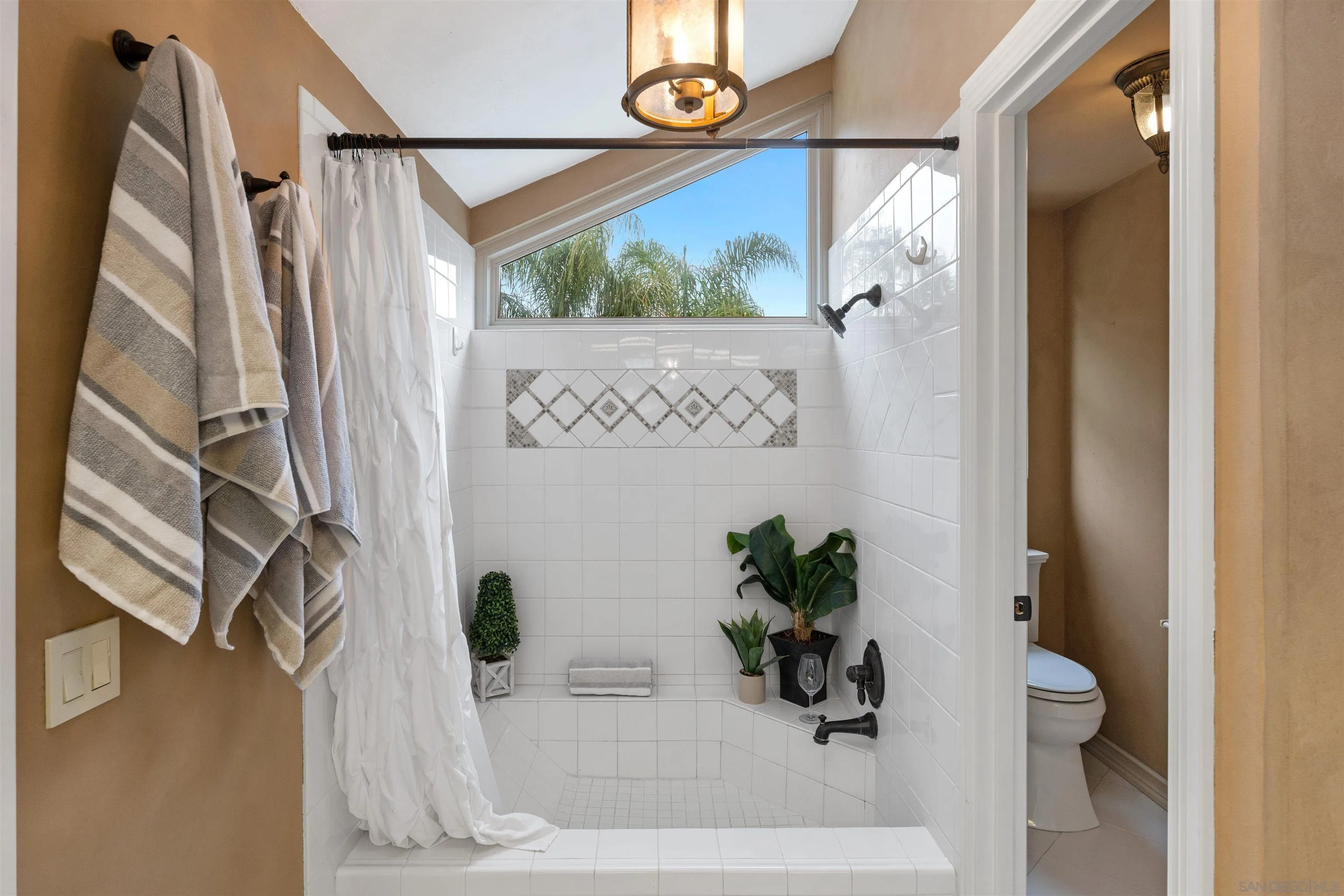 2312 Marca Place Carlsbad, CA 92009 - Photo 33 of 56 a white bath tub sitting next to a white door