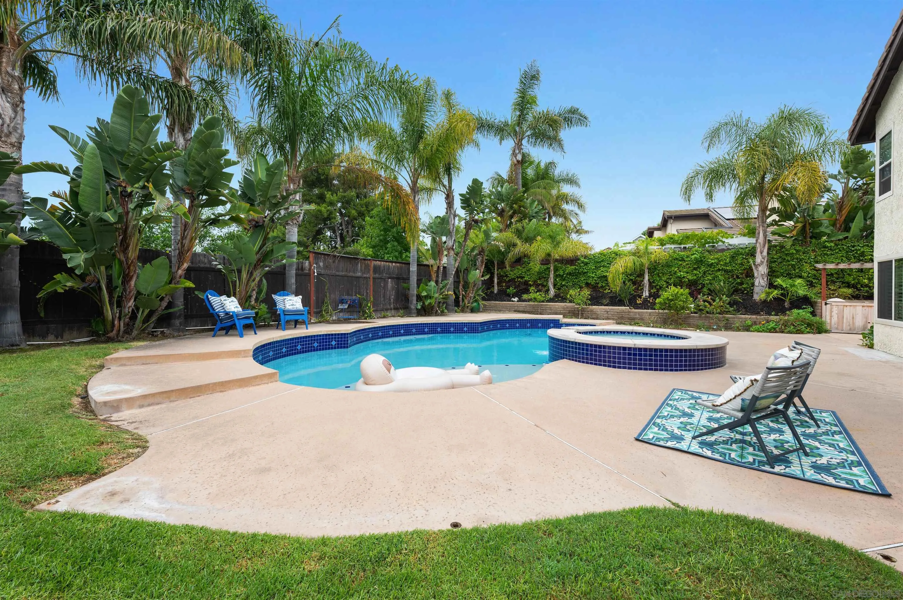 2312 Marca Place Carlsbad, CA 92009 - Photo 38 of 56 a view of a swimming pool with a garden