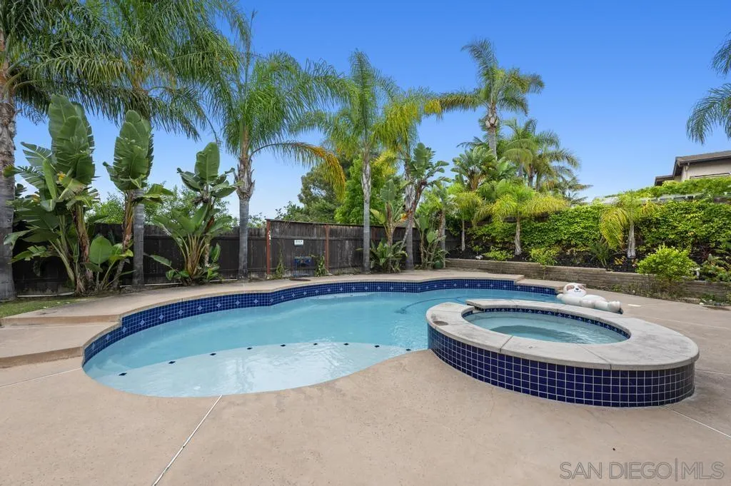 2312 Marca Place Carlsbad, CA 92009 - Photo 40 of 56 a view of a swimming pool with a patio