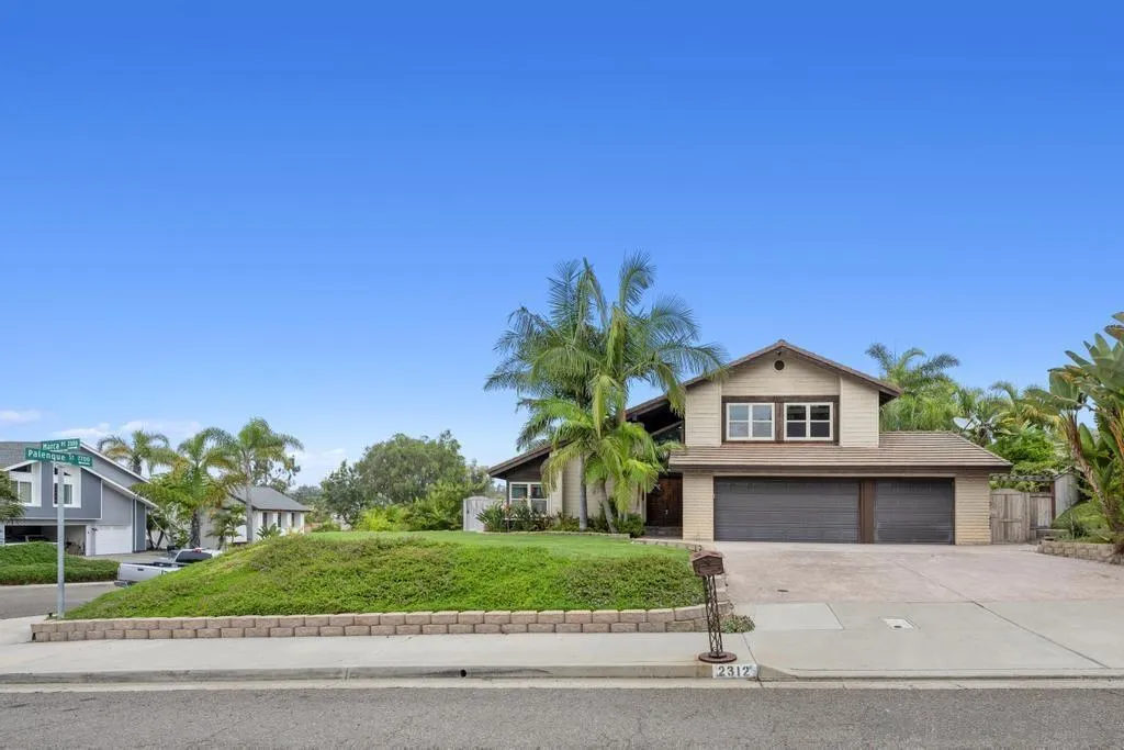 2312 Marca Place Carlsbad, CA 92009 - Photo 41 of 56 a view of a house with a yard and garage